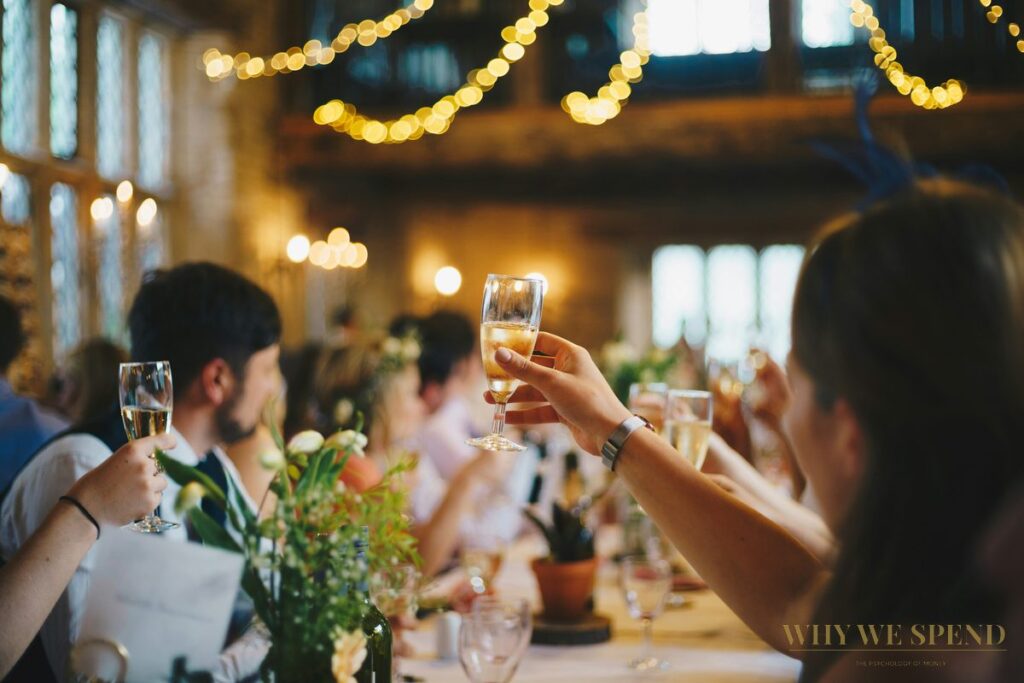Wedding celebration champagne toast — social obligation spending