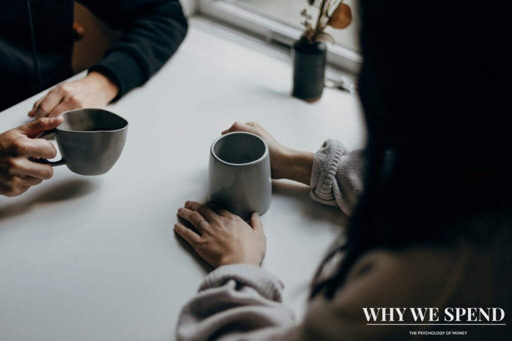 Two people having supportive conversation over coffee representing breaking isolation