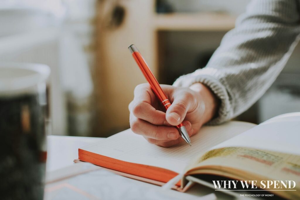 Person writing in journal with calm peaceful expression