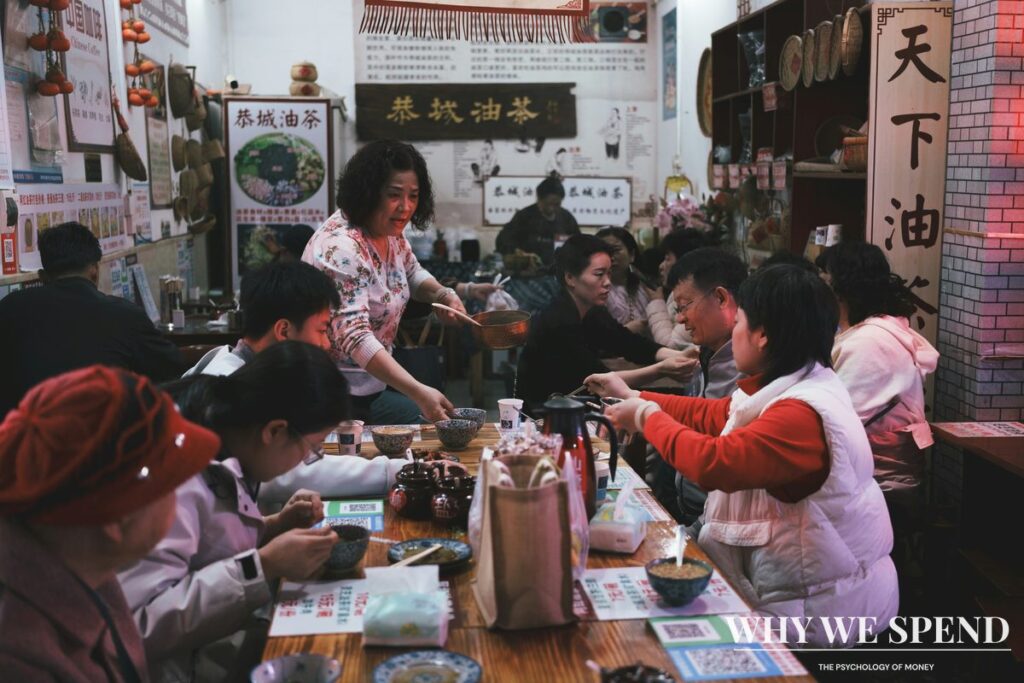 Asian family having serious discussion around dining table