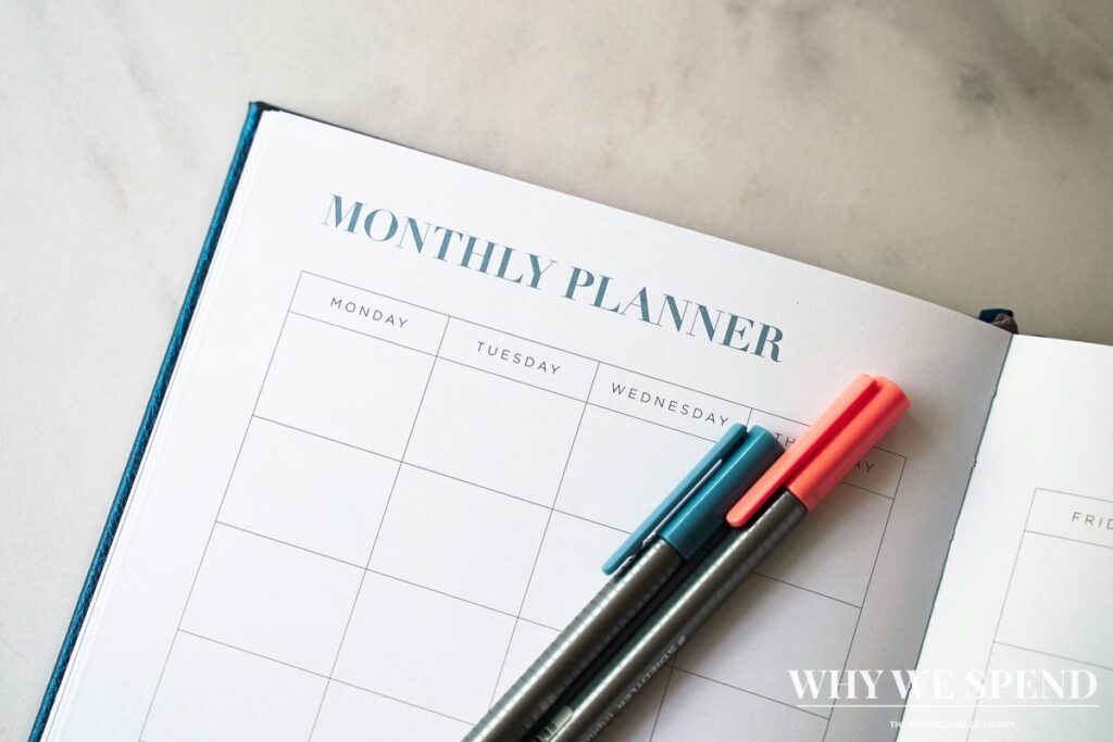 Abandoned budget planner notebook with uncompleted pages showing financial planning avoidance