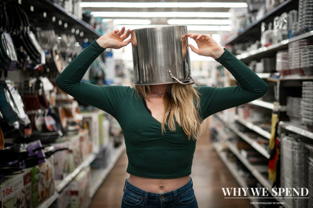 Shopper looking confused while comparing products in grocery store aisle