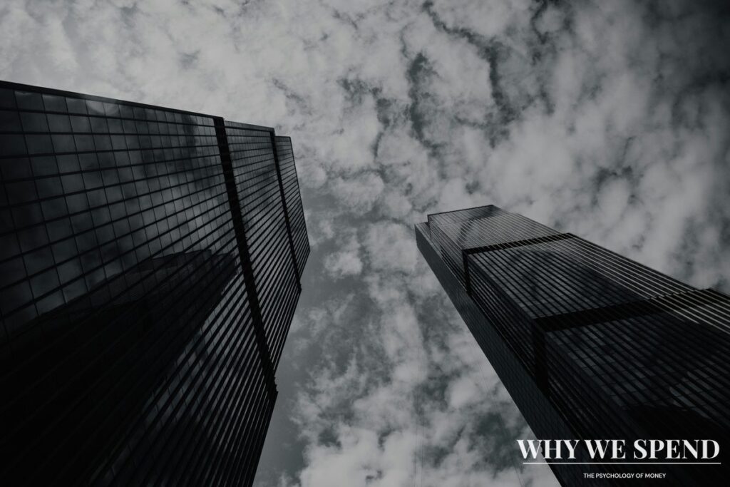 Upward view of corporate skyscrapers representing the overwhelming scale of corporate spending