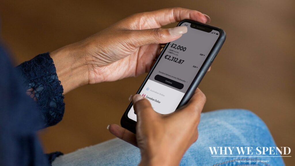 Close-up of person's hand hesitating over mobile banking app screen