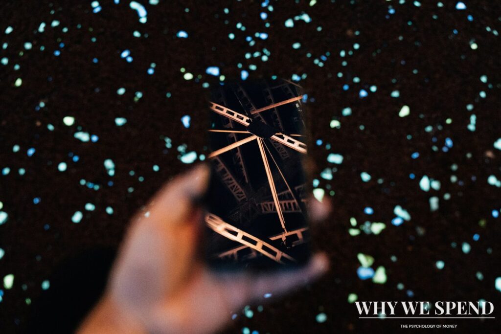 Person holding smartphone with futuristic holographic display representing technology optimism