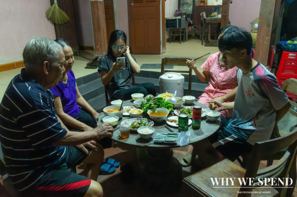 Asian family gathering around dinner table representing difficult inheritance conversations