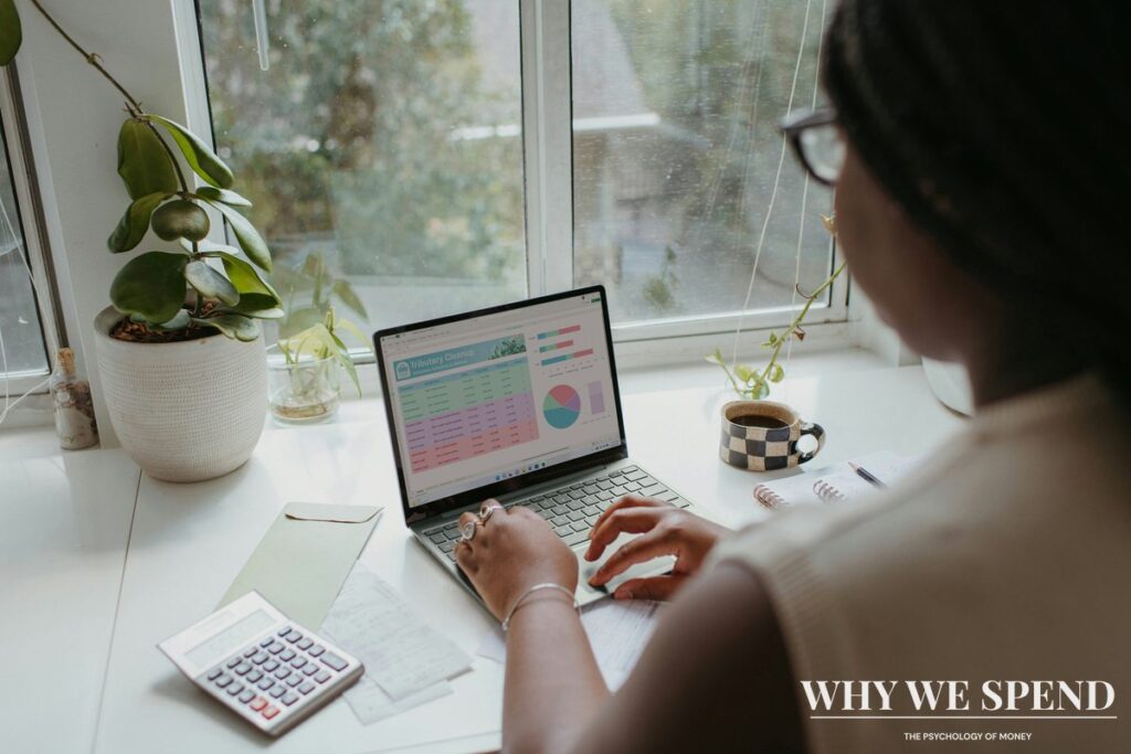 Person contemplating financial decisions with calculator representing mental accounting