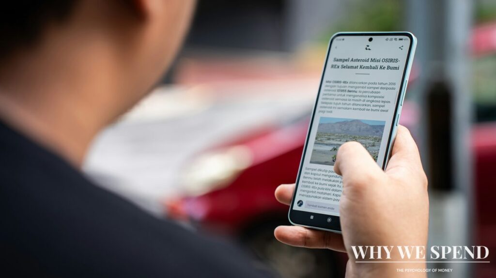Smartphone displaying corporate news headlines about cost-cutting and layoffs