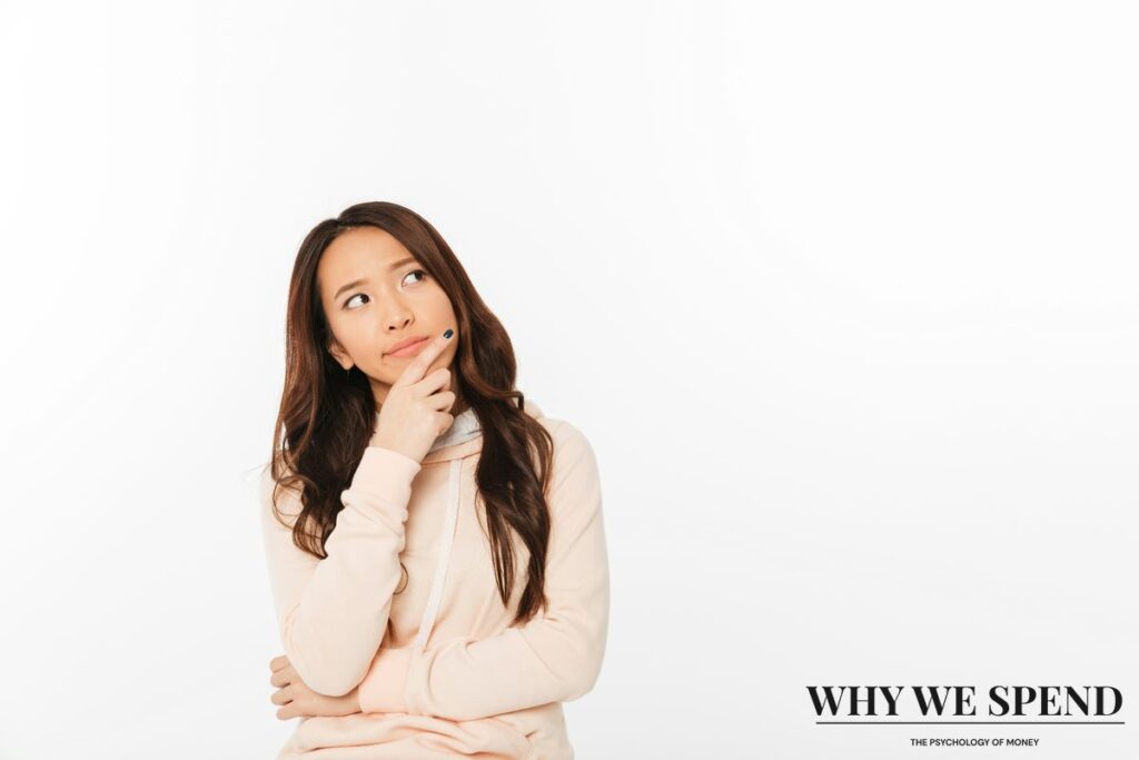 Calm woman reflecting thoughtfully while making personal financial decisions