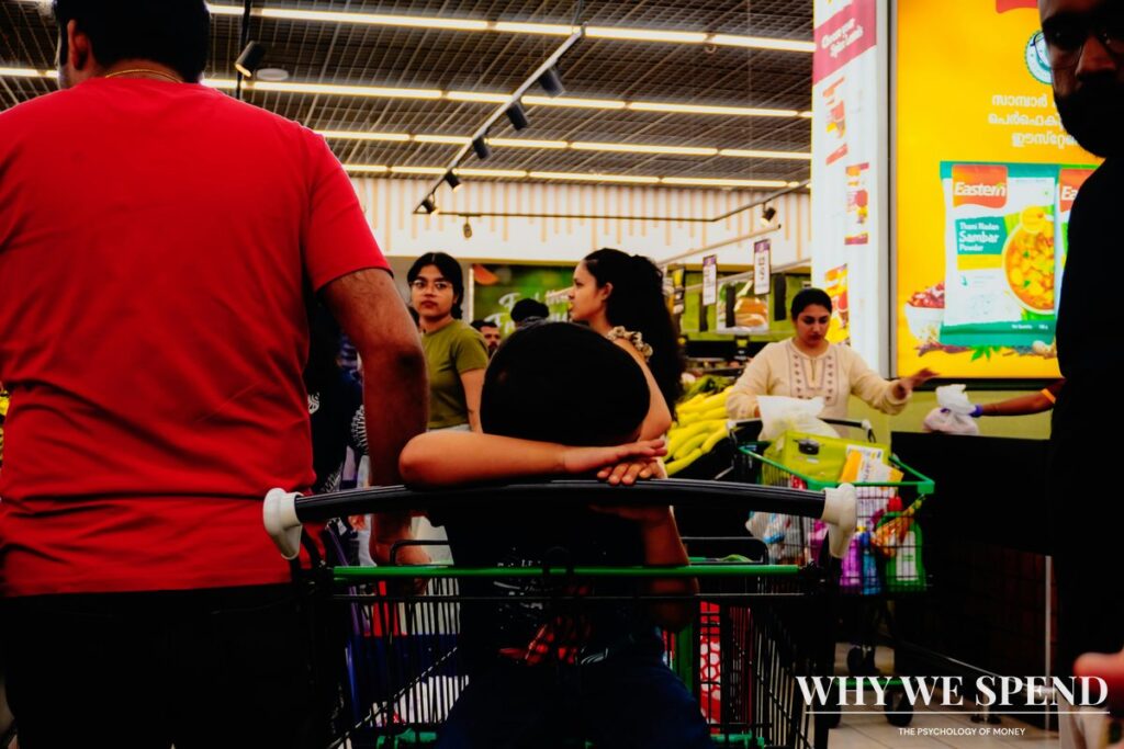 Shopping cart filled with groceries in supermarket aisle