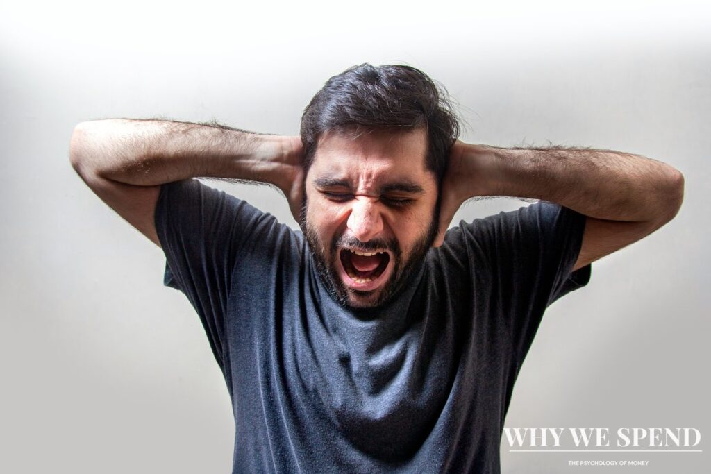 Person looking stressed and worried depicting psychological burden of financial secrecy