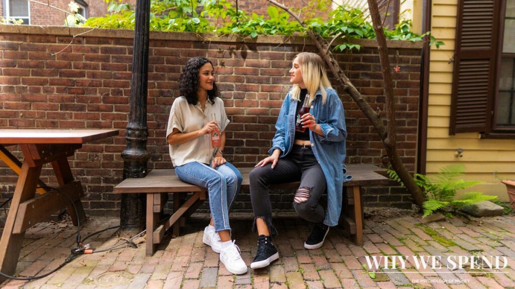 Two people in supportive conversation representing breaking silence about money problems