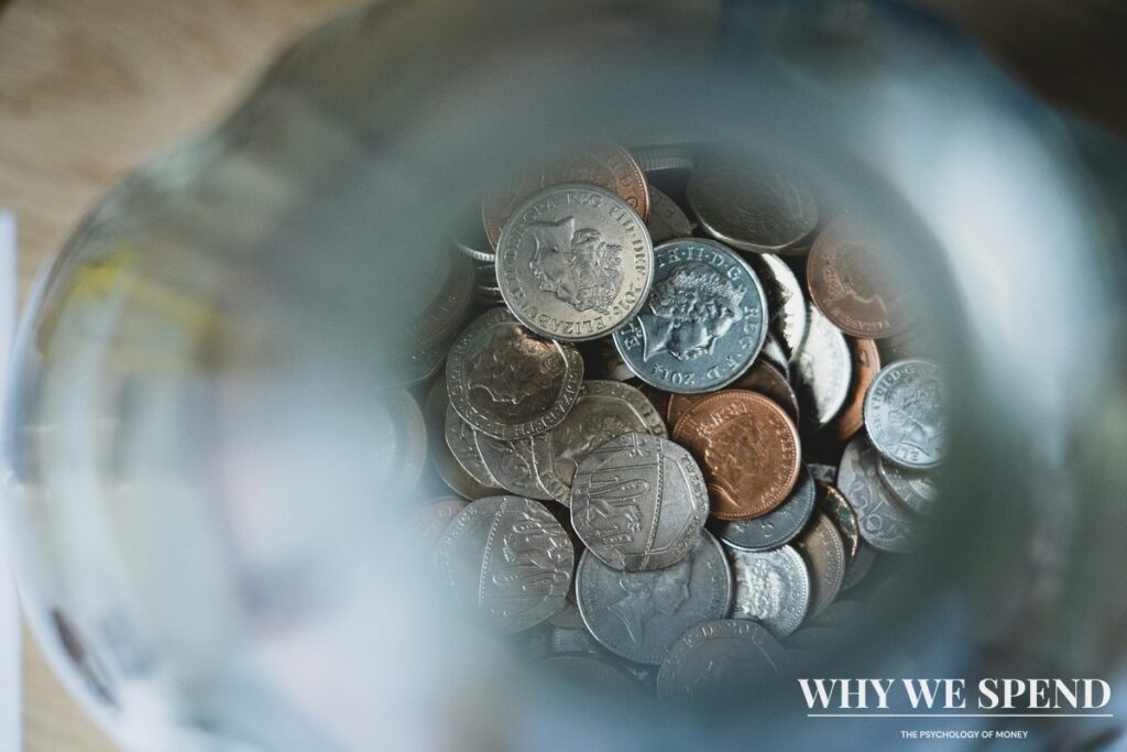 Glass jar filled with coins and notes representing savings growth