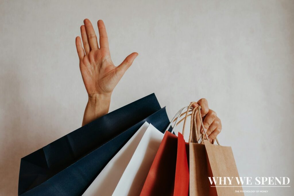 Asian woman surrounded by multiple shopping bags looking overwhelmed