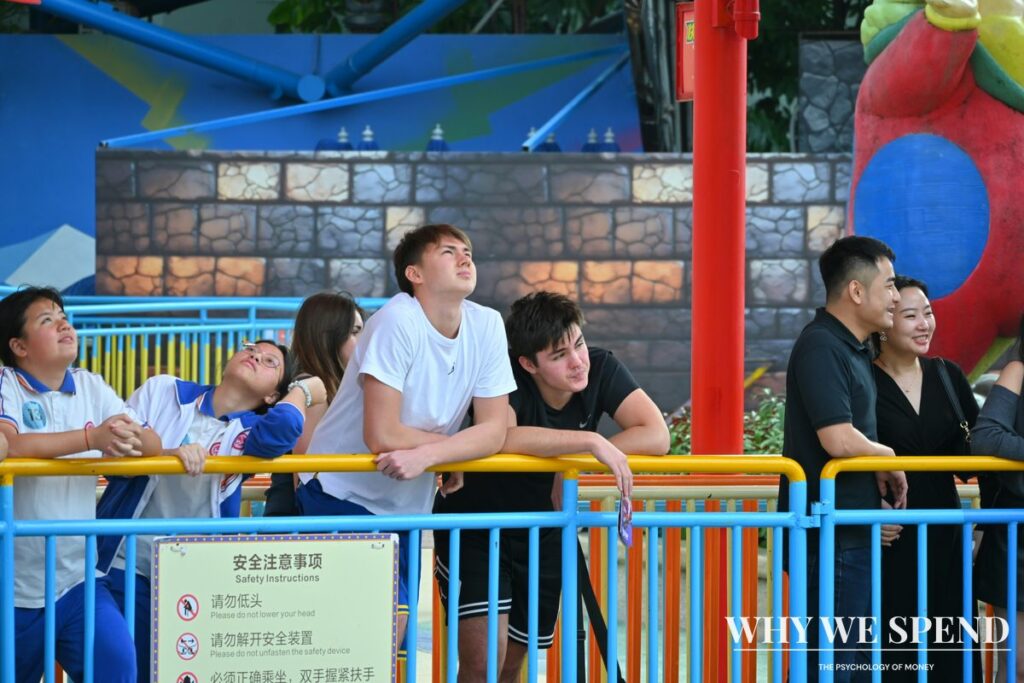 Long queue of people waiting at theme park entrance