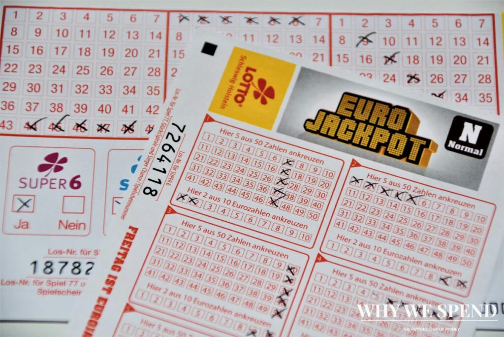 Close-up of lottery tickets and coins on a table representing financial decisions during hardship